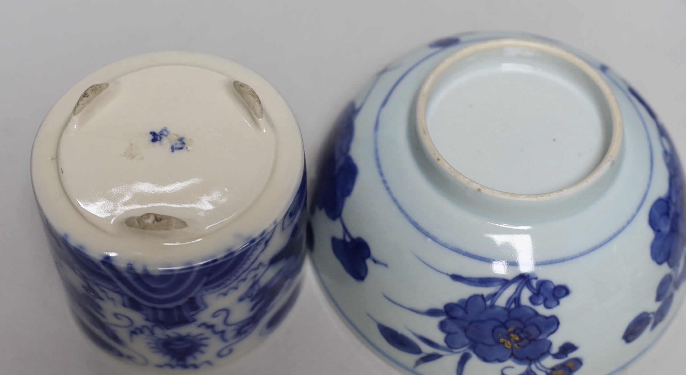 A Chinese pottery figure of a Sage, a blue and white brush pot and two bowls, sage 16cm high